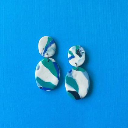 Abstract Oval In Teal, Navy, Sky Blue, Black, And..